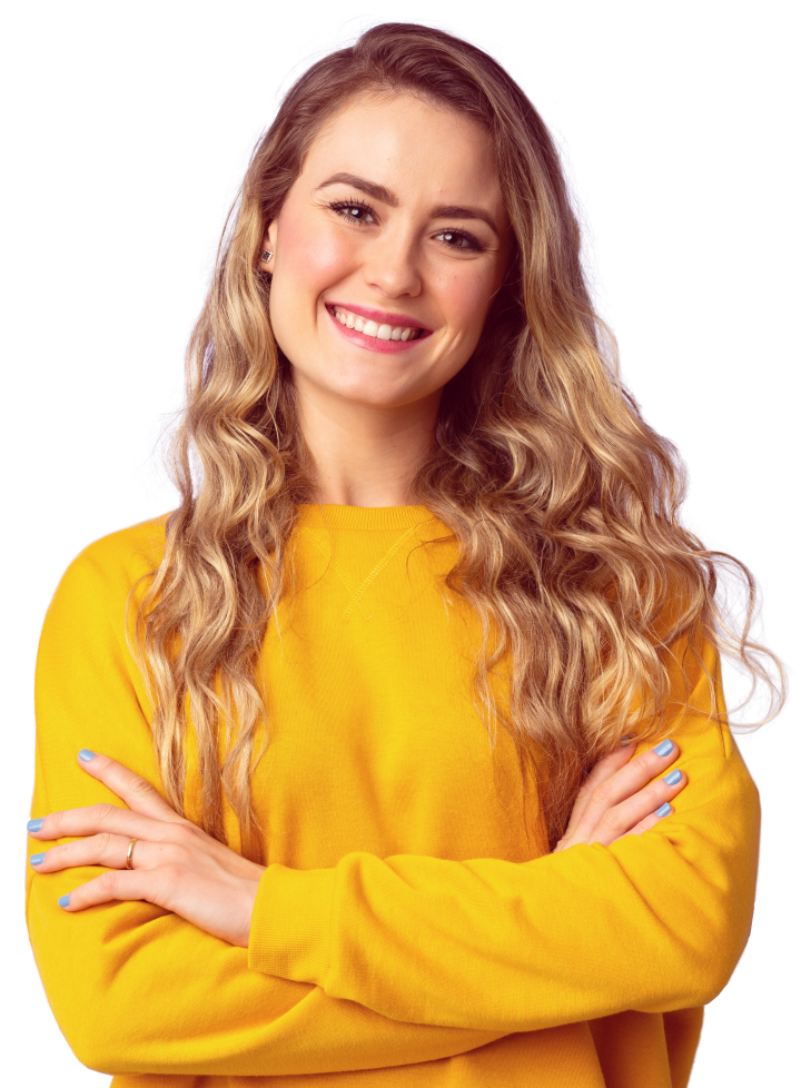 Smiling woman with long, wavy hair wearing a bright yellow sweater stands confidently with crossed arms. The tone is warm and approachable.