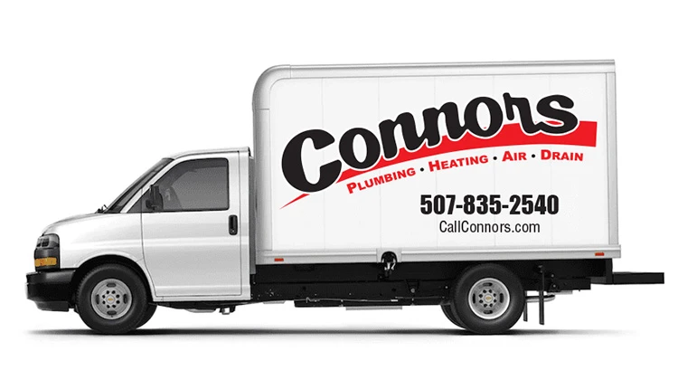 White service truck with Connors Plumbing, Heating, Air, Drain on the side in bold letters. Includes phone number and website. Appears professional and reliable.